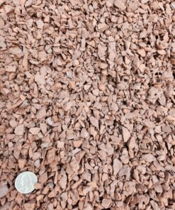 An overhead photo shows a pile of small, reddish-brown, angular rocks. A shiny silver coin is in the bottom left corner, providing a sense of scale.
